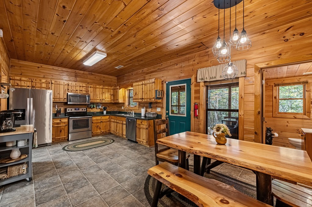 196 Ethan Wilson Way Morganton, GA 30560 - Photo 16 of 66 a kitchen with sink refrigerator and cabinets