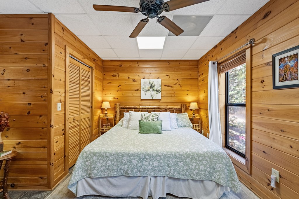 196 Ethan Wilson Way Morganton, GA 30560 - Photo 23 of 66 a bedroom with a bed and wooden floor