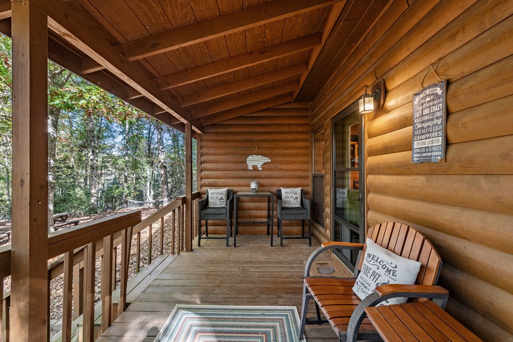 196 Ethan Wilson Way Morganton, GA 30560 - Photo 36 of 66 a view of a chairs and table in the balcony
