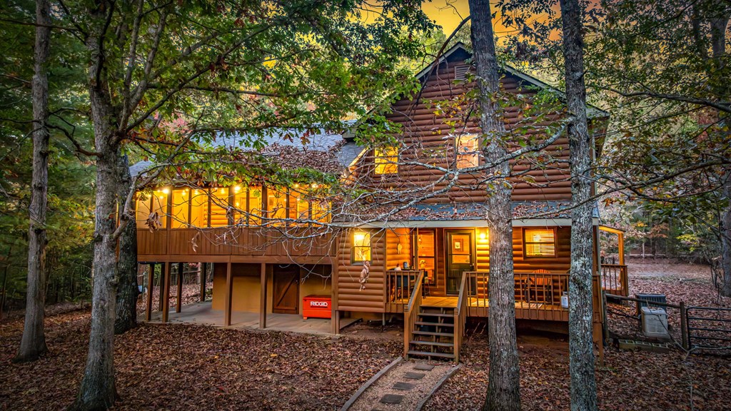 196 Ethan Wilson Way Morganton, GA 30560 - Photo 38 of 66 a view of a house with a patio and a yard