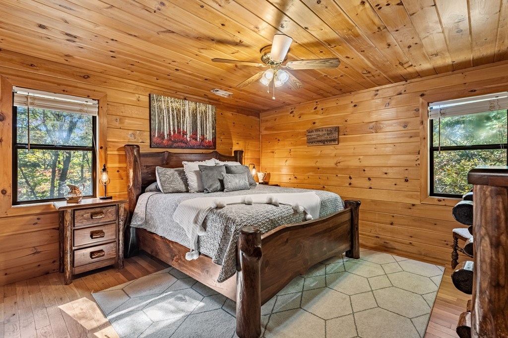 196 Ethan Wilson Way Morganton, GA 30560 - Photo 42 of 66 a bedroom with a bed and a flat tv screen