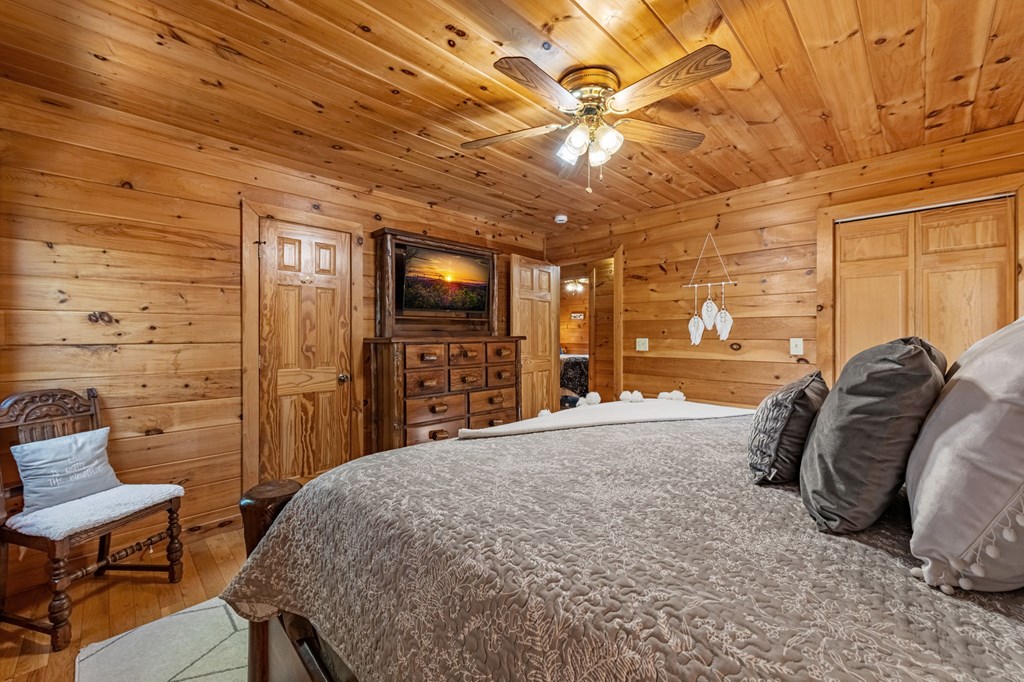 196 Ethan Wilson Way Morganton, GA 30560 - Photo 44 of 66 a bed sitting in a spacious bedroom next to a window