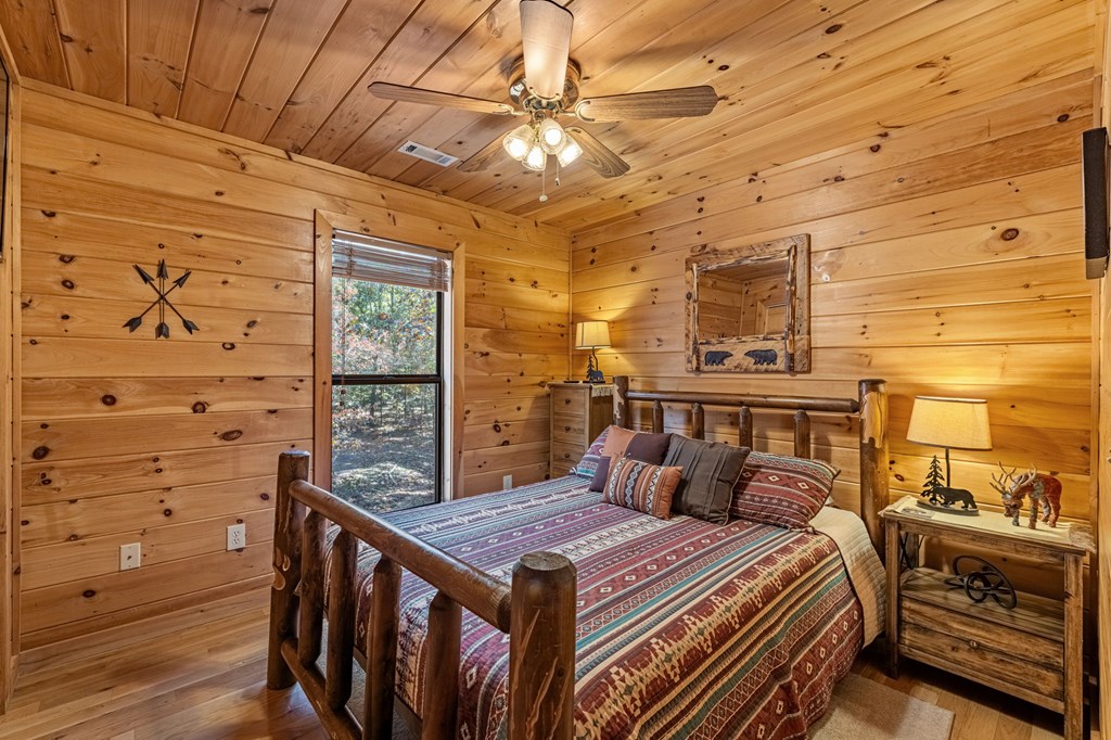 196 Ethan Wilson Way Morganton, GA 30560 - Photo 48 of 66 a spacious bedroom with a bed and a dresser