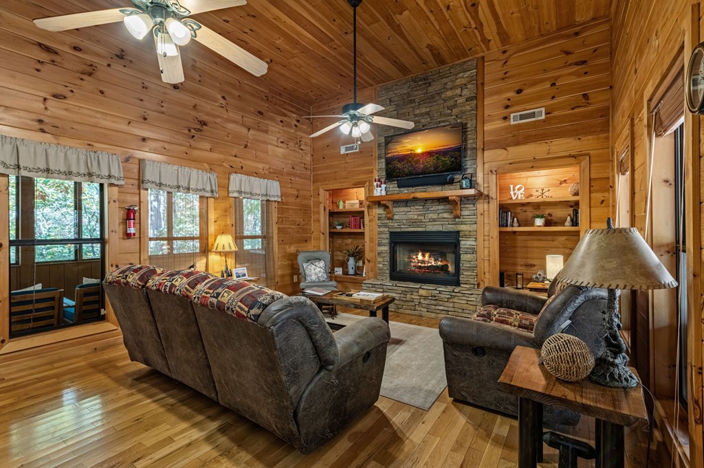 196 Ethan Wilson Way Morganton, GA 30560 - Photo 5 of 66 a living room with furniture flat screen tv and a fireplace