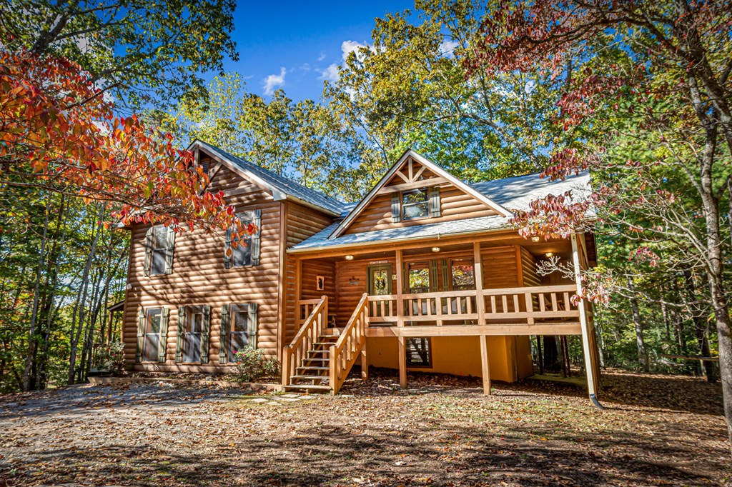196 Ethan Wilson Way Morganton, GA 30560 - Photo 59 of 66 a front view of a house with a garden