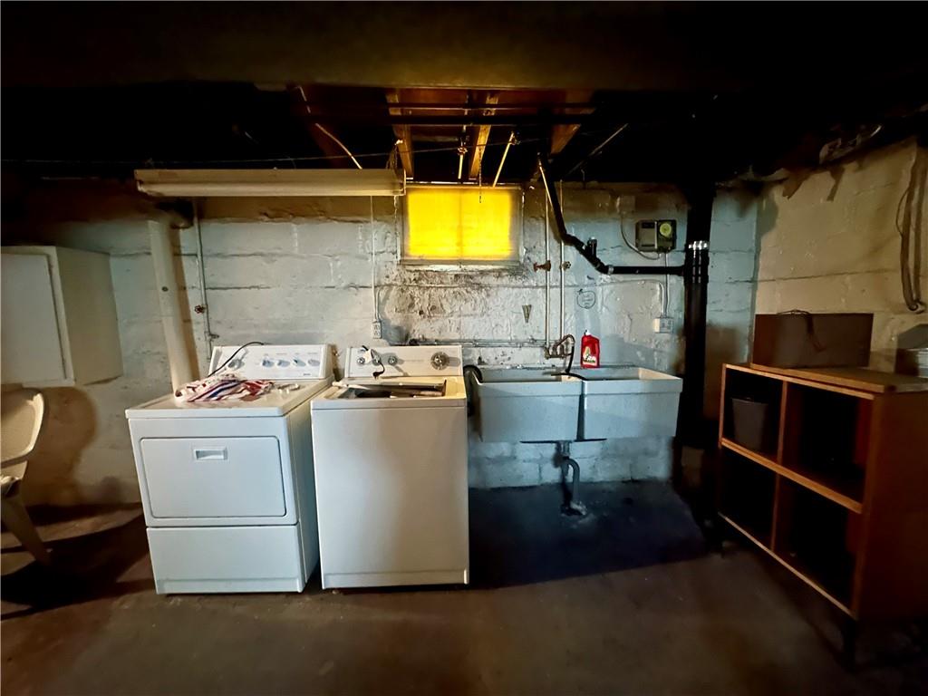 741 Frederick Street McKees Rocks, PA 15136 - Photo 15 of 18 a storage room with washer and a view of living room
