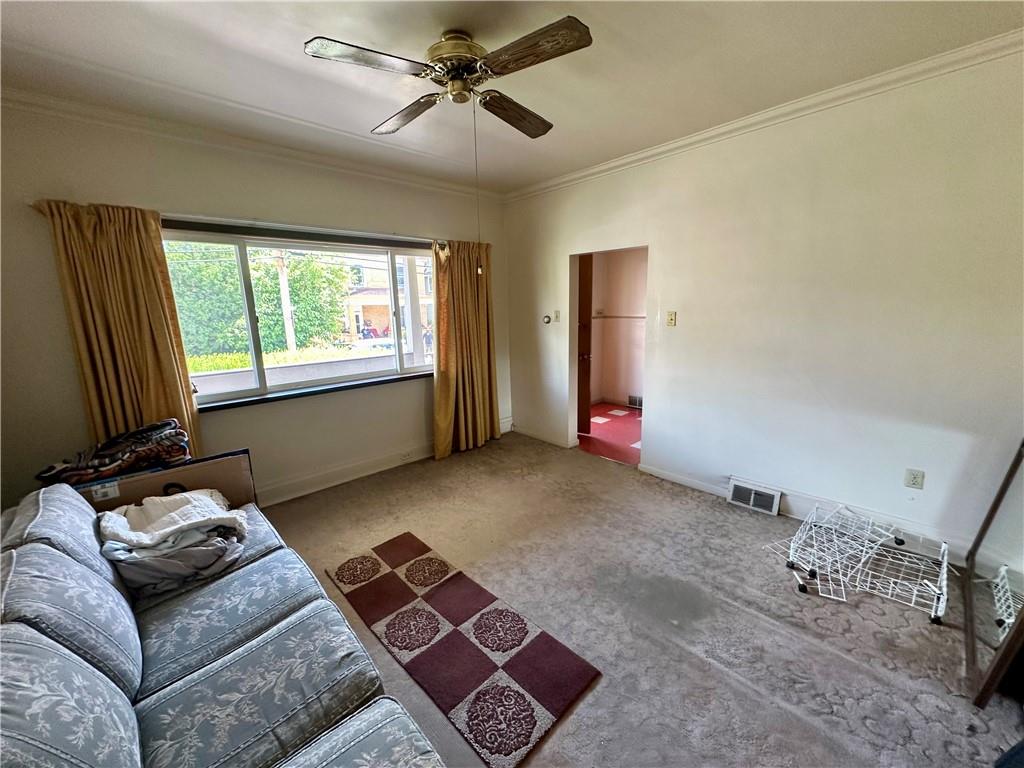 741 Frederick Street McKees Rocks, PA 15136 - Photo 4 of 18 a living room with furniture and a window