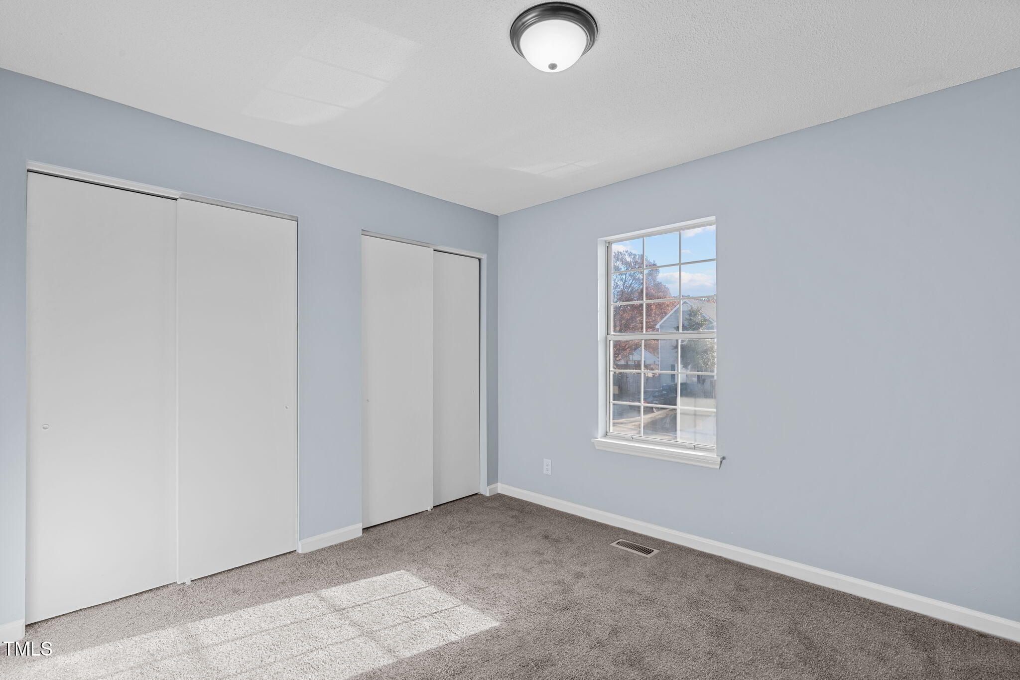 605 Stratton Way Durham, NC 27704 - Photo 16 of 46 an empty room with windows