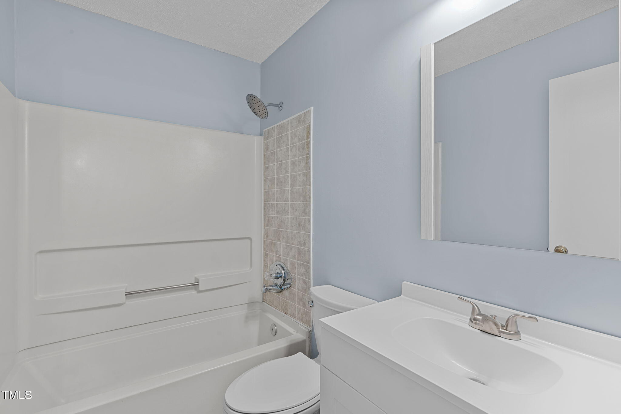 605 Stratton Way Durham, NC 27704 - Photo 18 of 46 a bathroom with a sink and a mirror