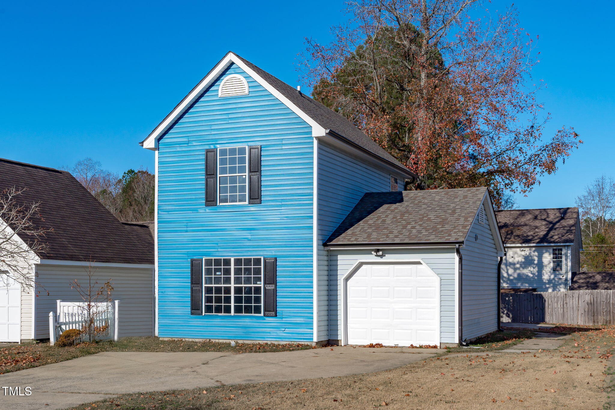 605 Stratton Way Durham, NC 27704 - Photo 29 of 46 a front view of a house with a yard and garage
