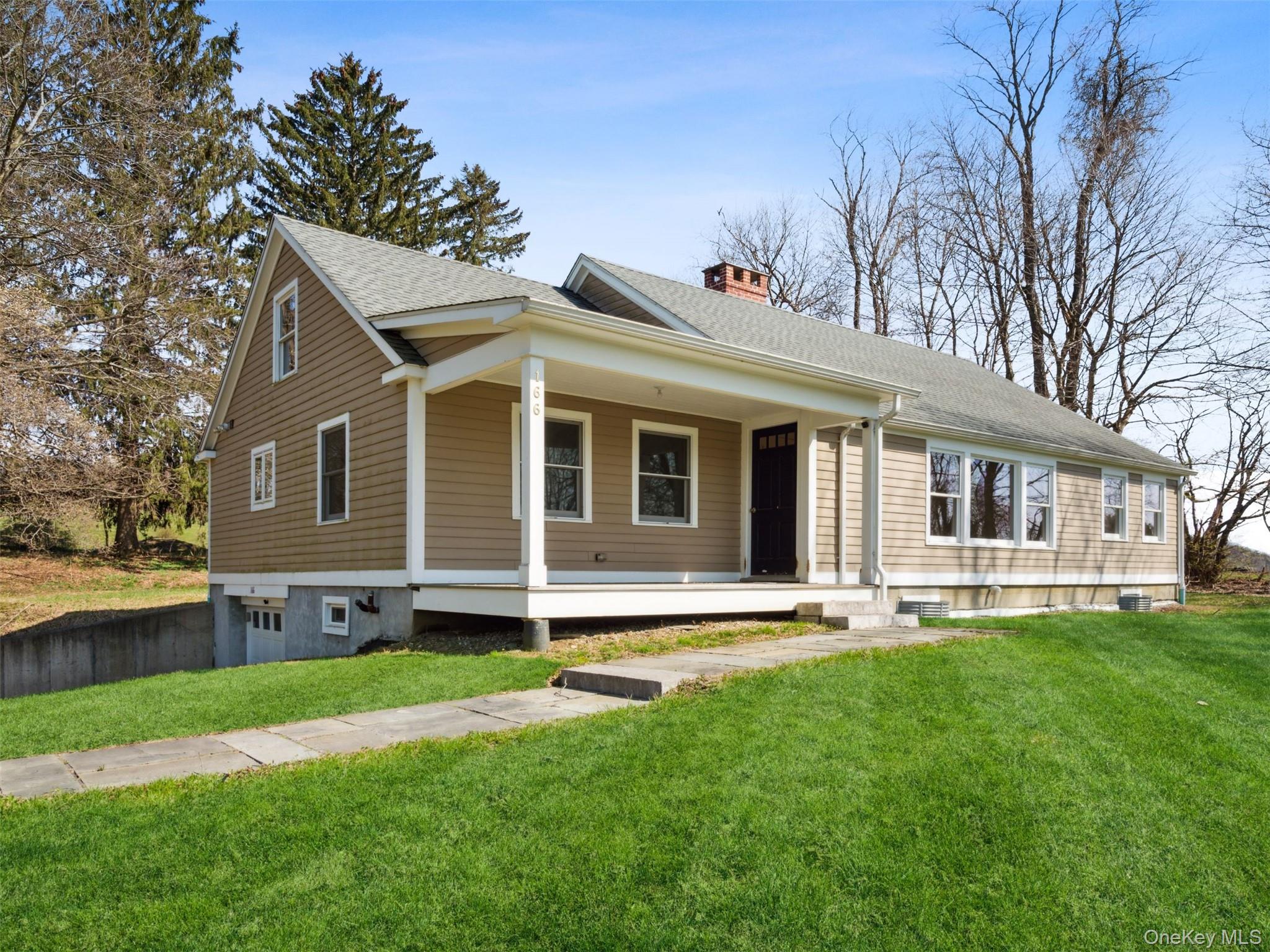 156 Sharon Station Road Amenia, NY 12501 - Photo 18 of 18 a front view of a house with a yard and trees