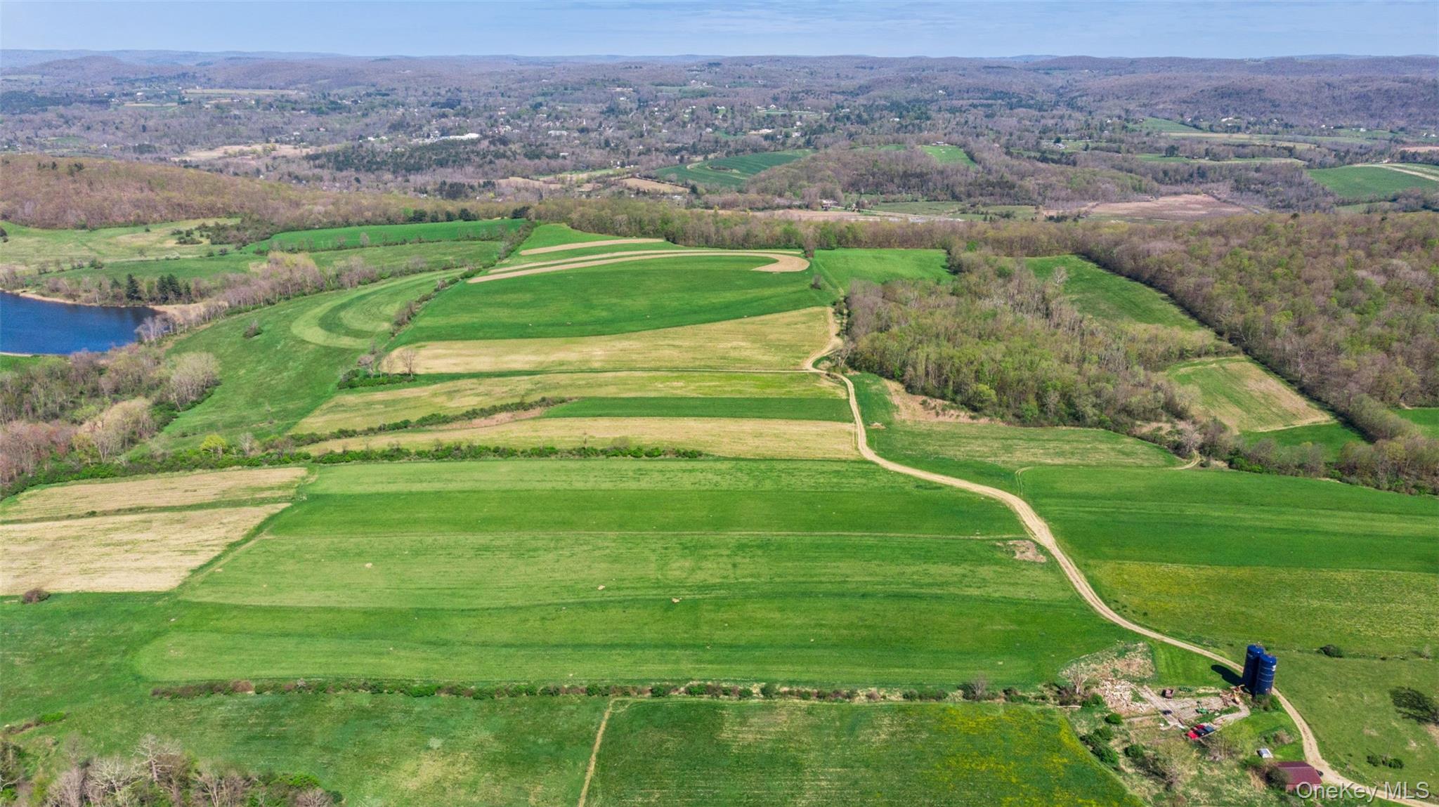 156 Sharon Station Road Amenia, NY 12501 - Photo 8 of 18 an aerial view of a golf course with a swimming pool