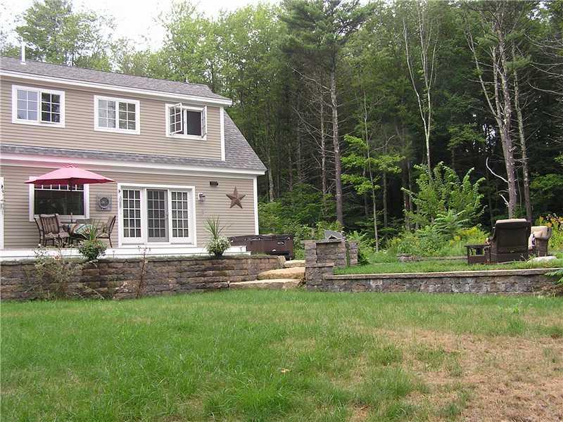 177 Mountain Road York, ME 03902 - Photo 4 of 23 Exterior Back. A back yard and deck...