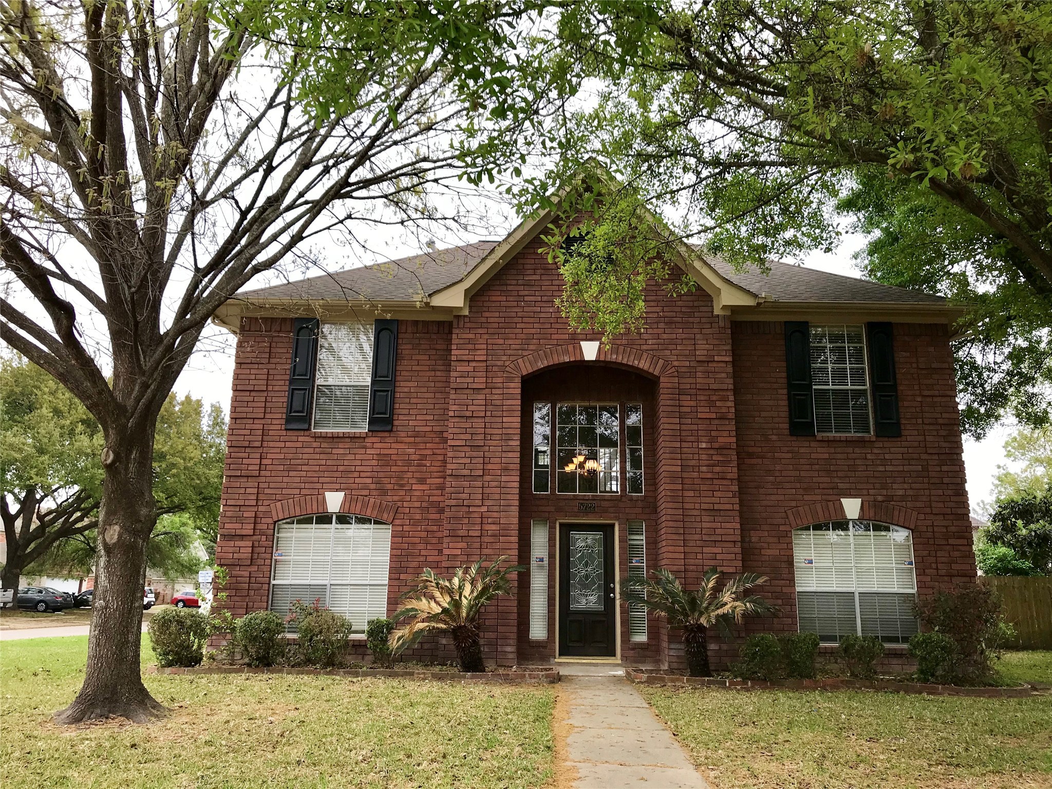a front view of a house with garden
