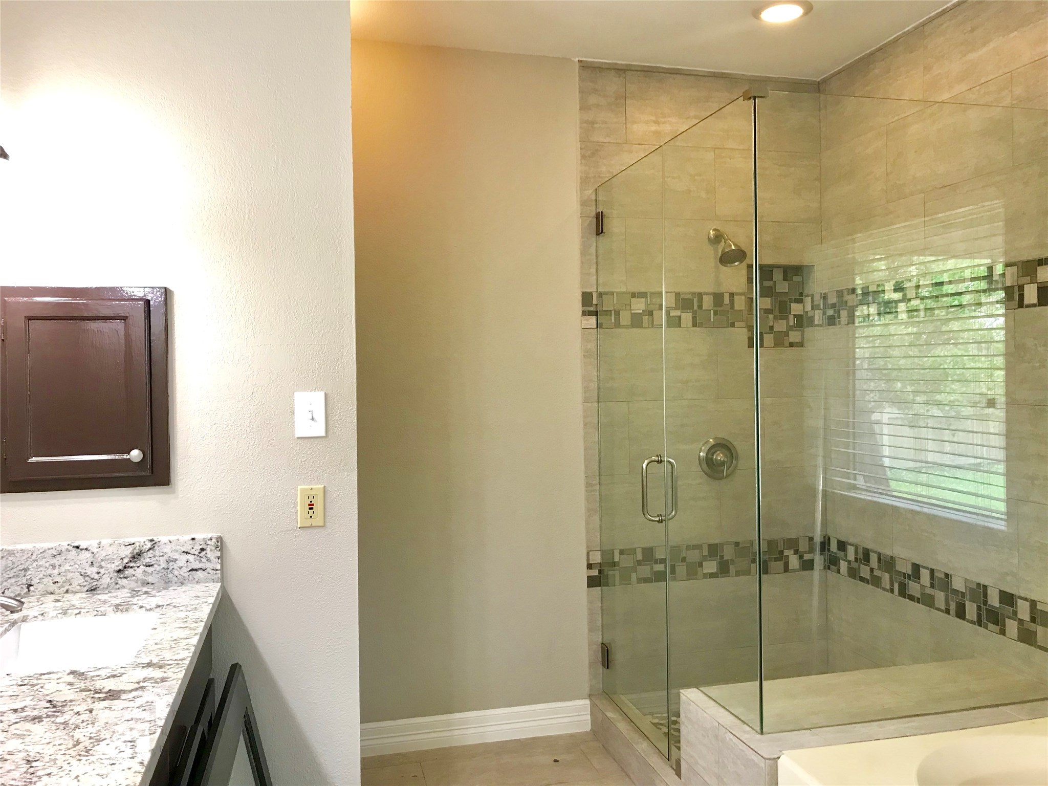 5722 Fort Sumter Lane Houston, TX 77084 - Photo 15 of 22 a bathroom with a granite countertop sink a mirror and shower