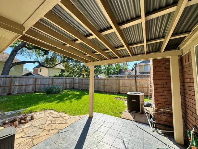 a view of a backyard with sitting area