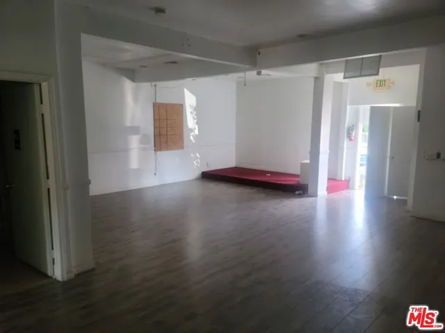 a view of a livingroom with wooden floor