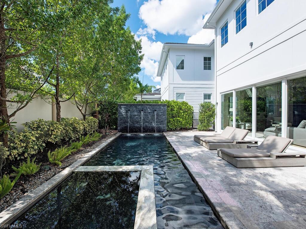 9200 Mercato Way Naples, FL 34108 - Photo 2 of 13 a view of backyard with patio