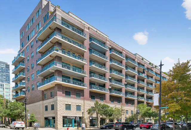 a view of a house with a yard and tree s