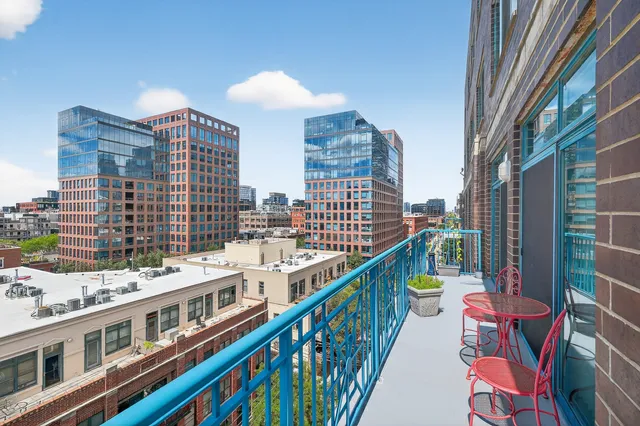 a view of a hallway with dining room and wooden floor
