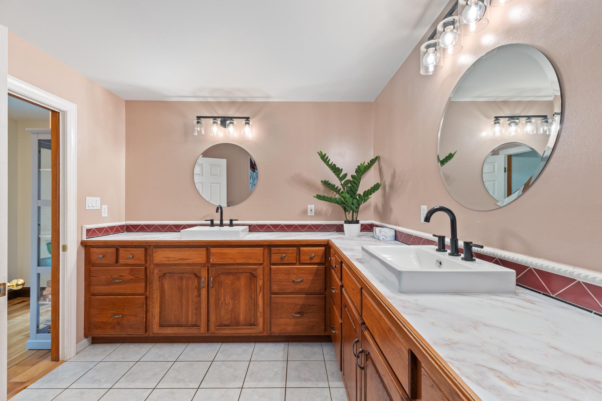 40 Christman Road Kutztown, PA 19530 - Photo 22 of 48 a bathroom with a double vanity sink and a mirror