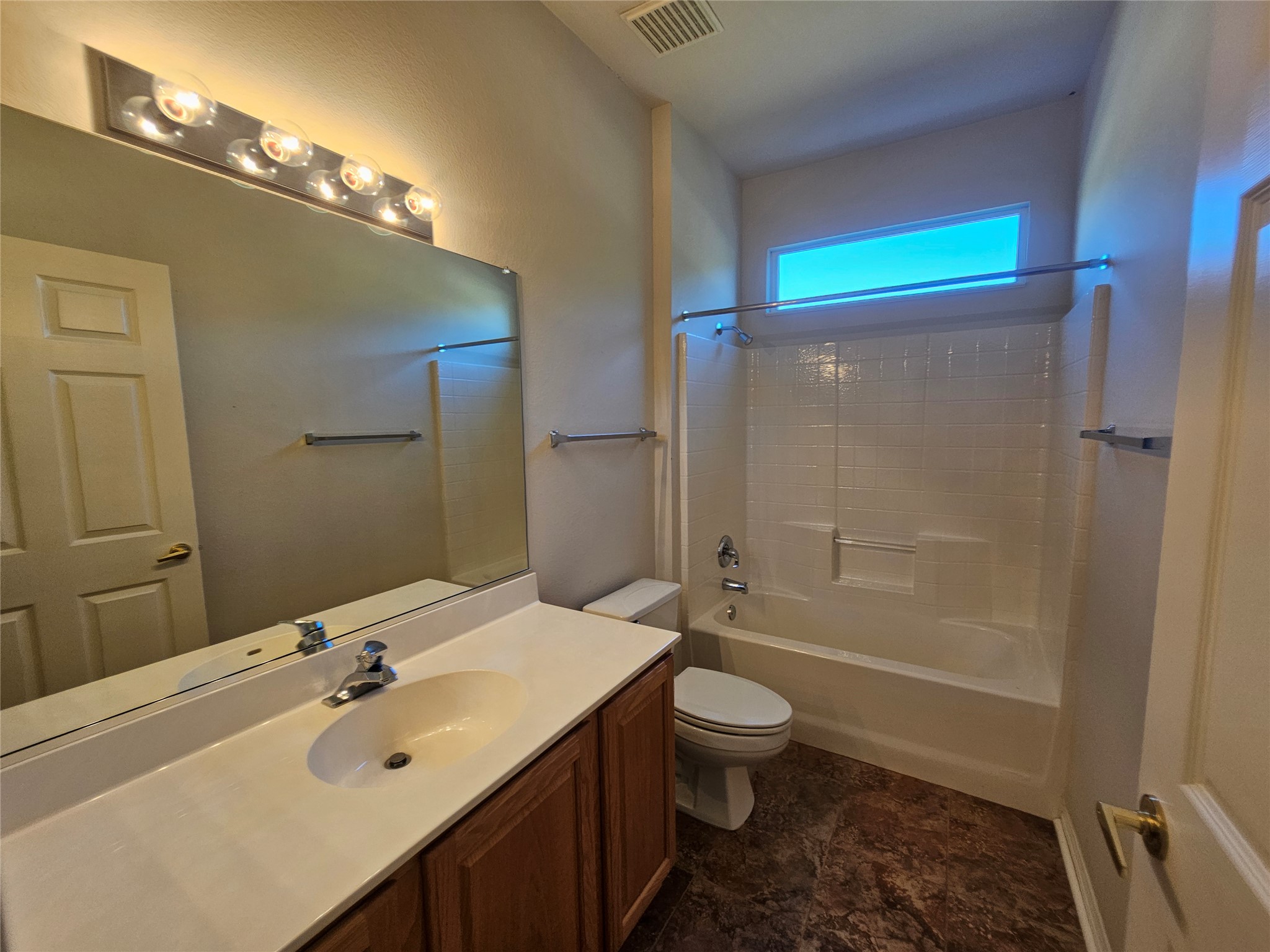 211 Red Poppy Trail Georgetown, TX 78633 - Photo 14 of 35 a bathroom with a sink a toilet and shower