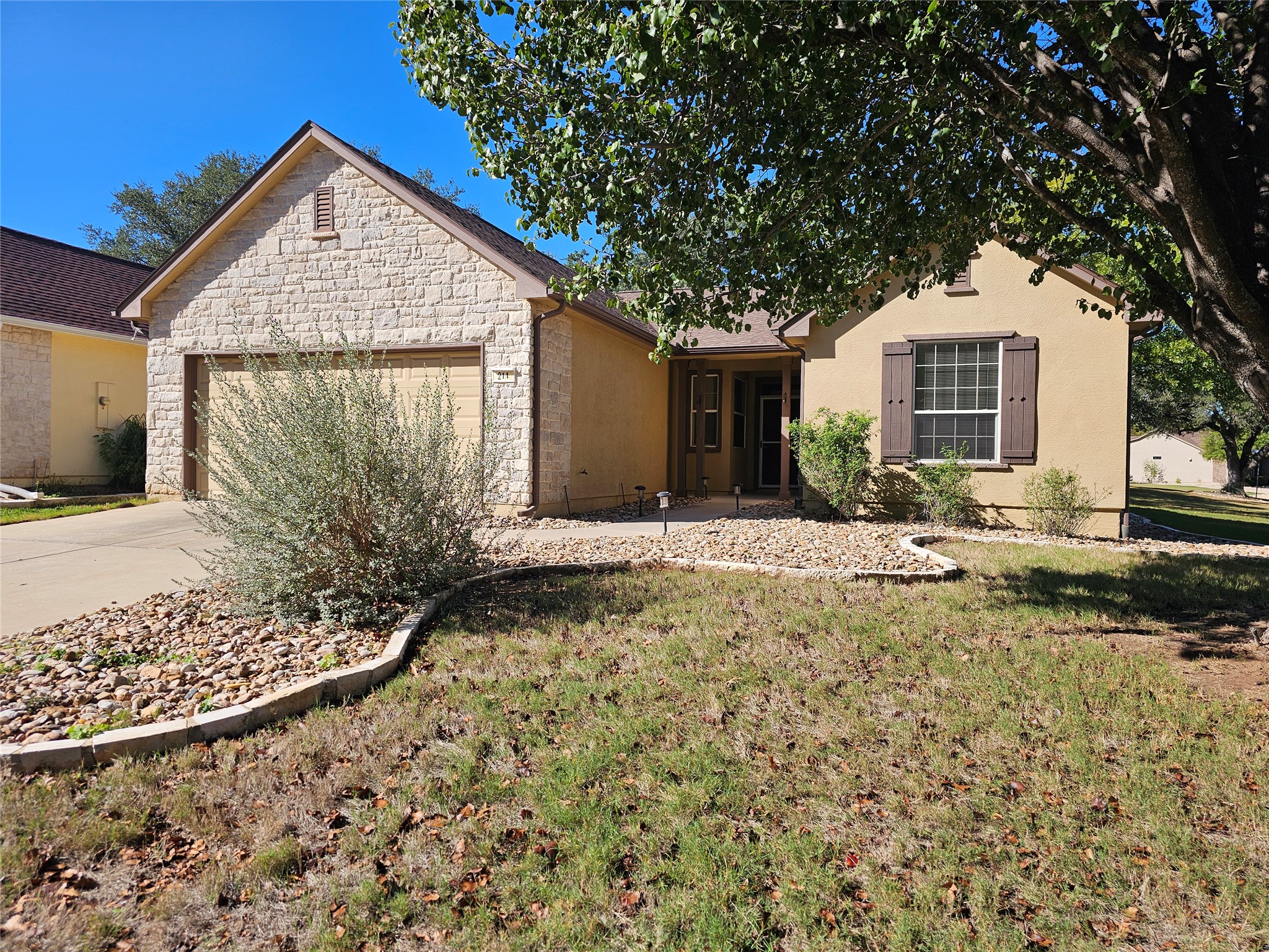 211 Red Poppy Trail Georgetown, TX 78633 - Photo 2 of 35 a front view of a house with garden