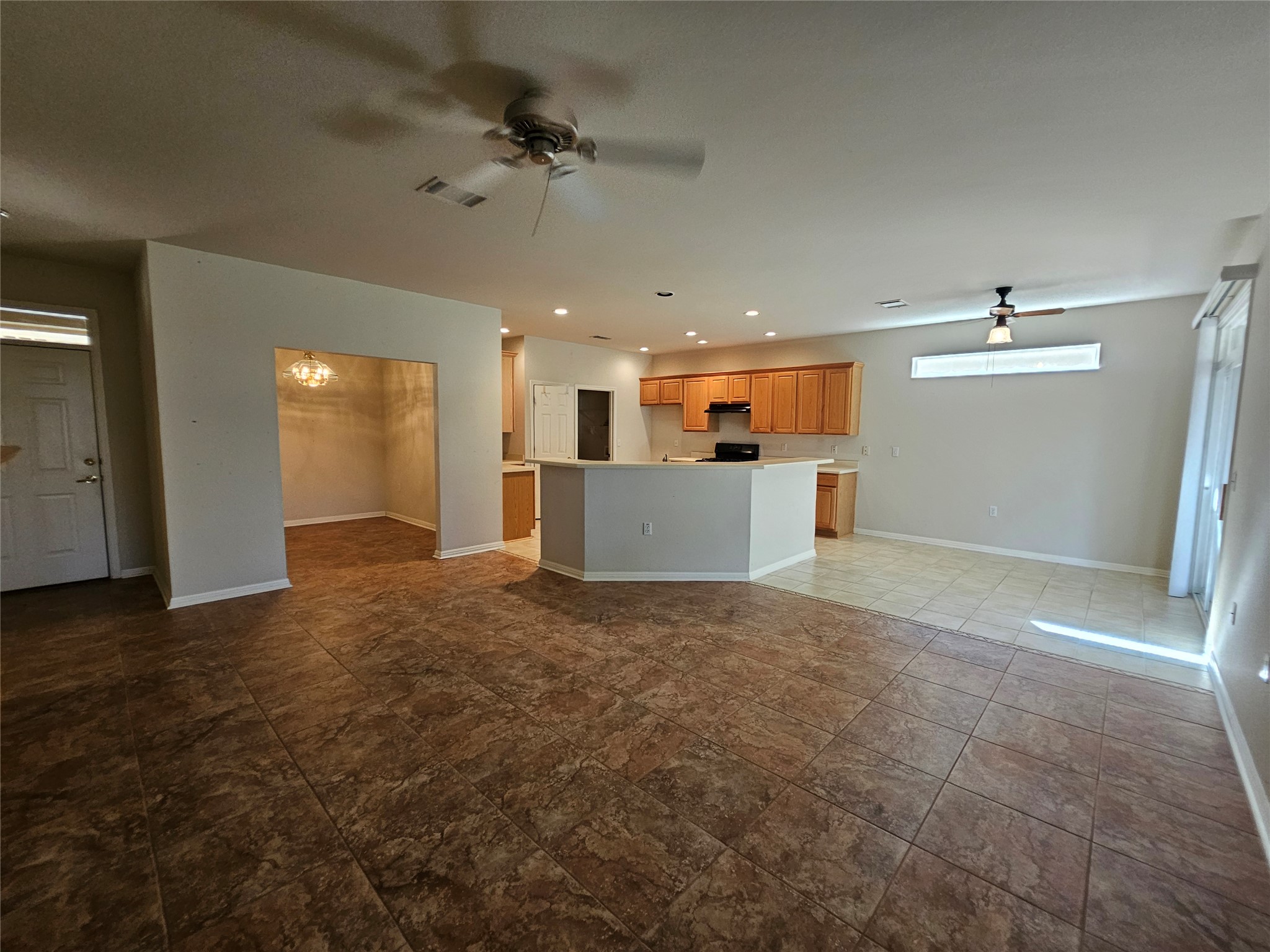 211 Red Poppy Trail Georgetown, TX 78633 - Photo 23 of 35 a view of a kitchen with a sink and a refrigerator