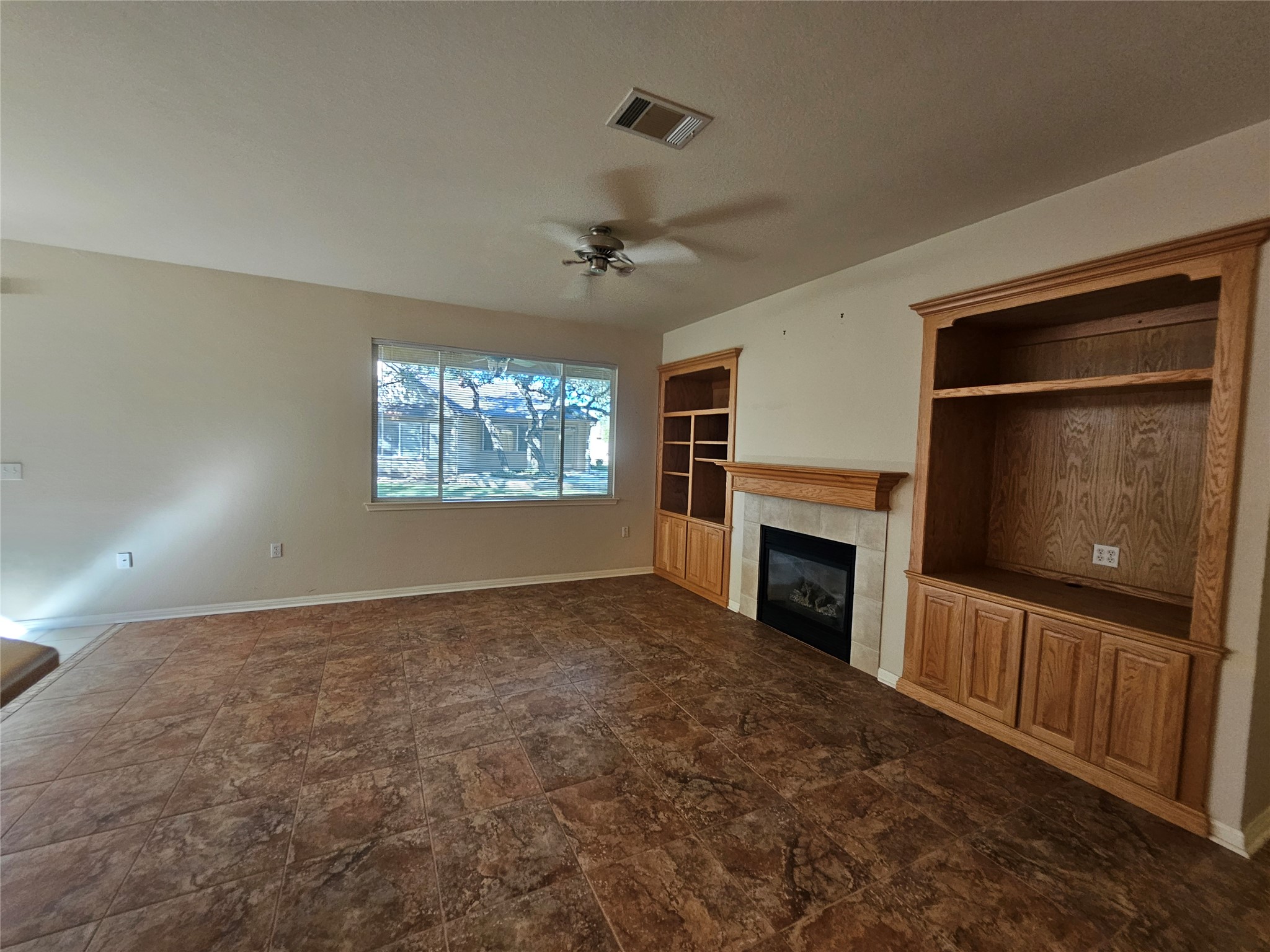 211 Red Poppy Trail Georgetown, TX 78633 - Photo 24 of 35 a view of empty room with a fireplace