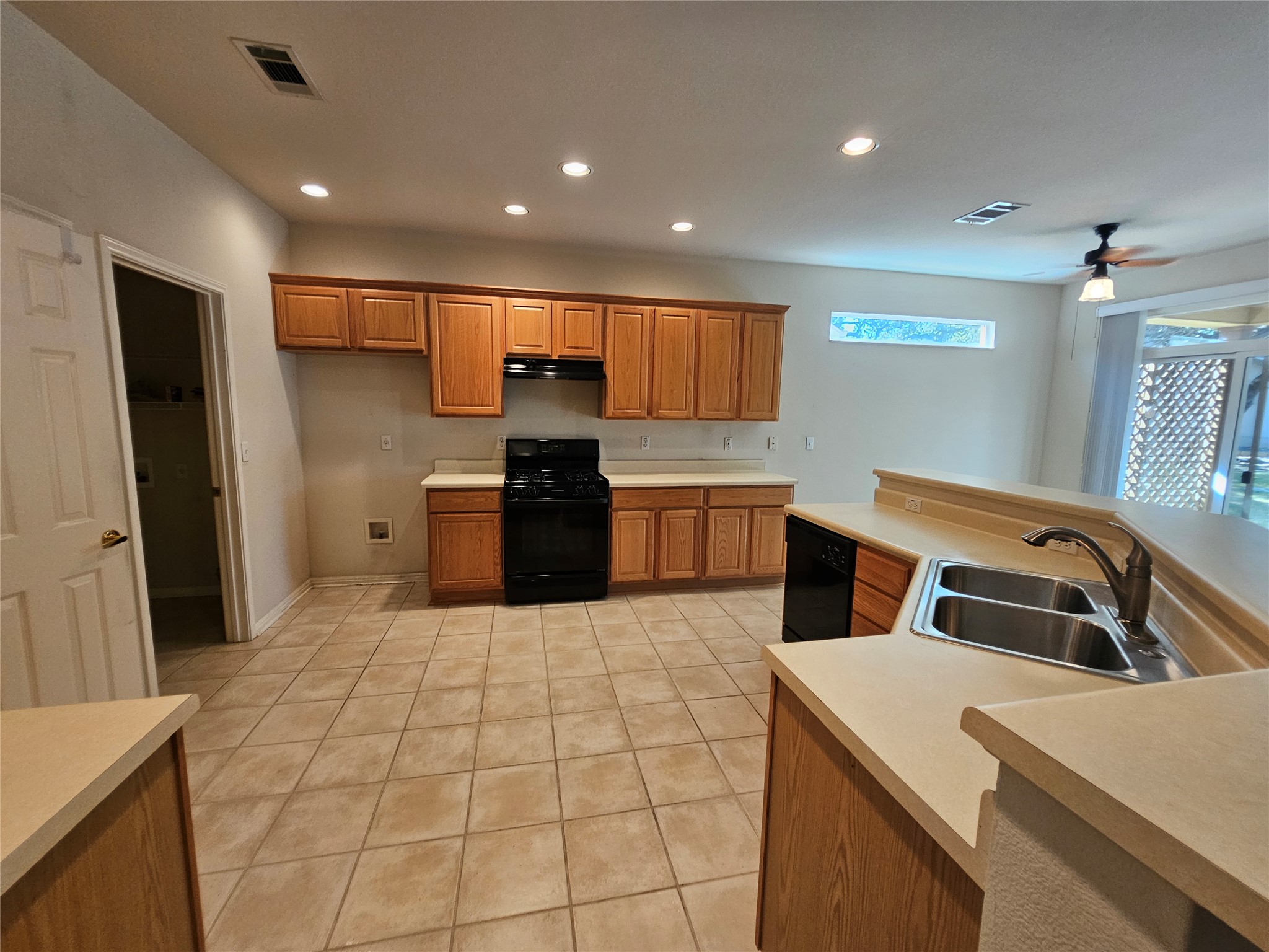211 Red Poppy Trail Georgetown, TX 78633 - Photo 25 of 35 a kitchen with stainless steel appliances kitchen island granite countertop a sink and a refrigerator