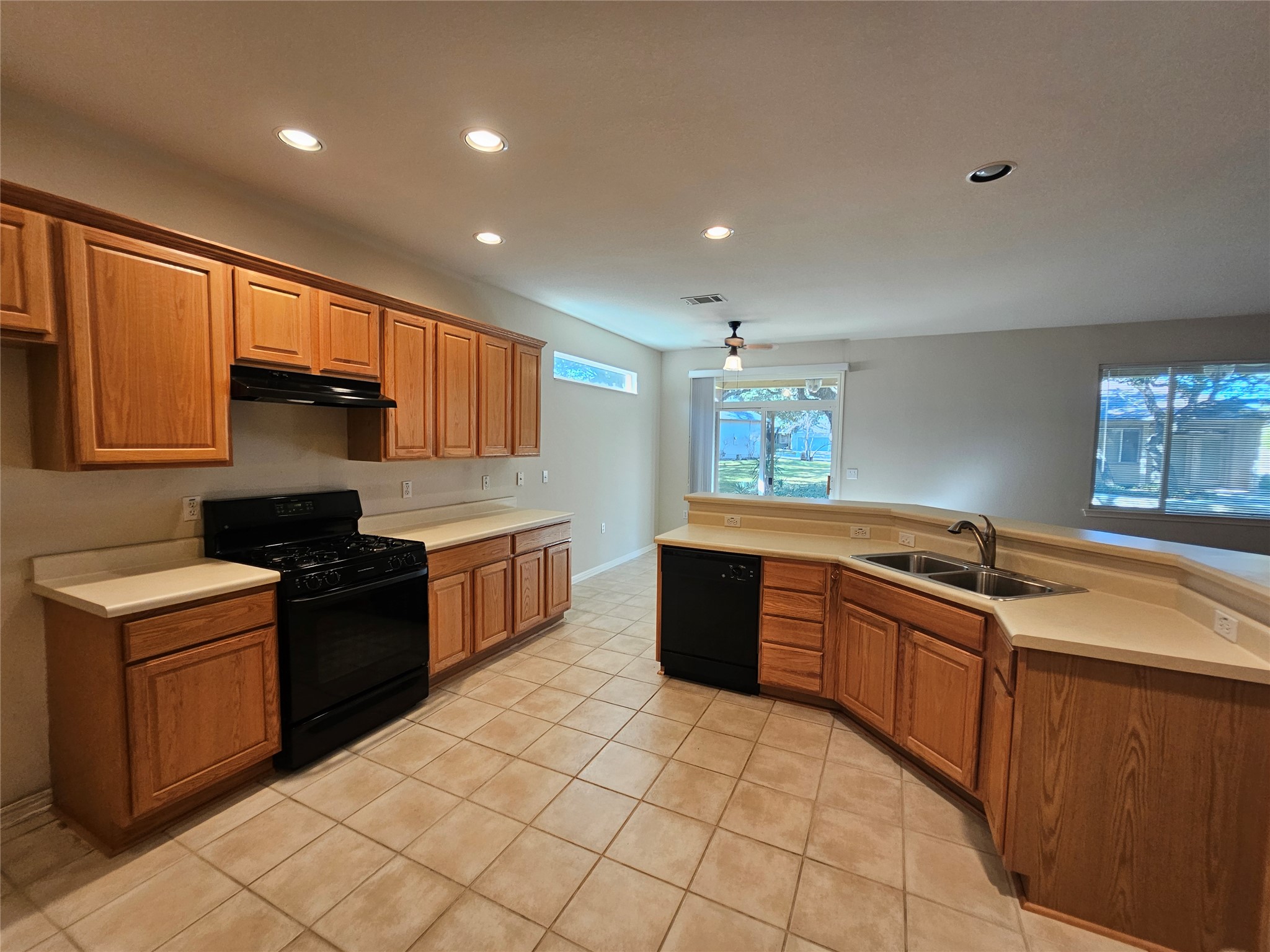211 Red Poppy Trail Georgetown, TX 78633 - Photo 26 of 35 a kitchen with stainless steel appliances granite countertop a stove a sink dishwasher and a refrigerator