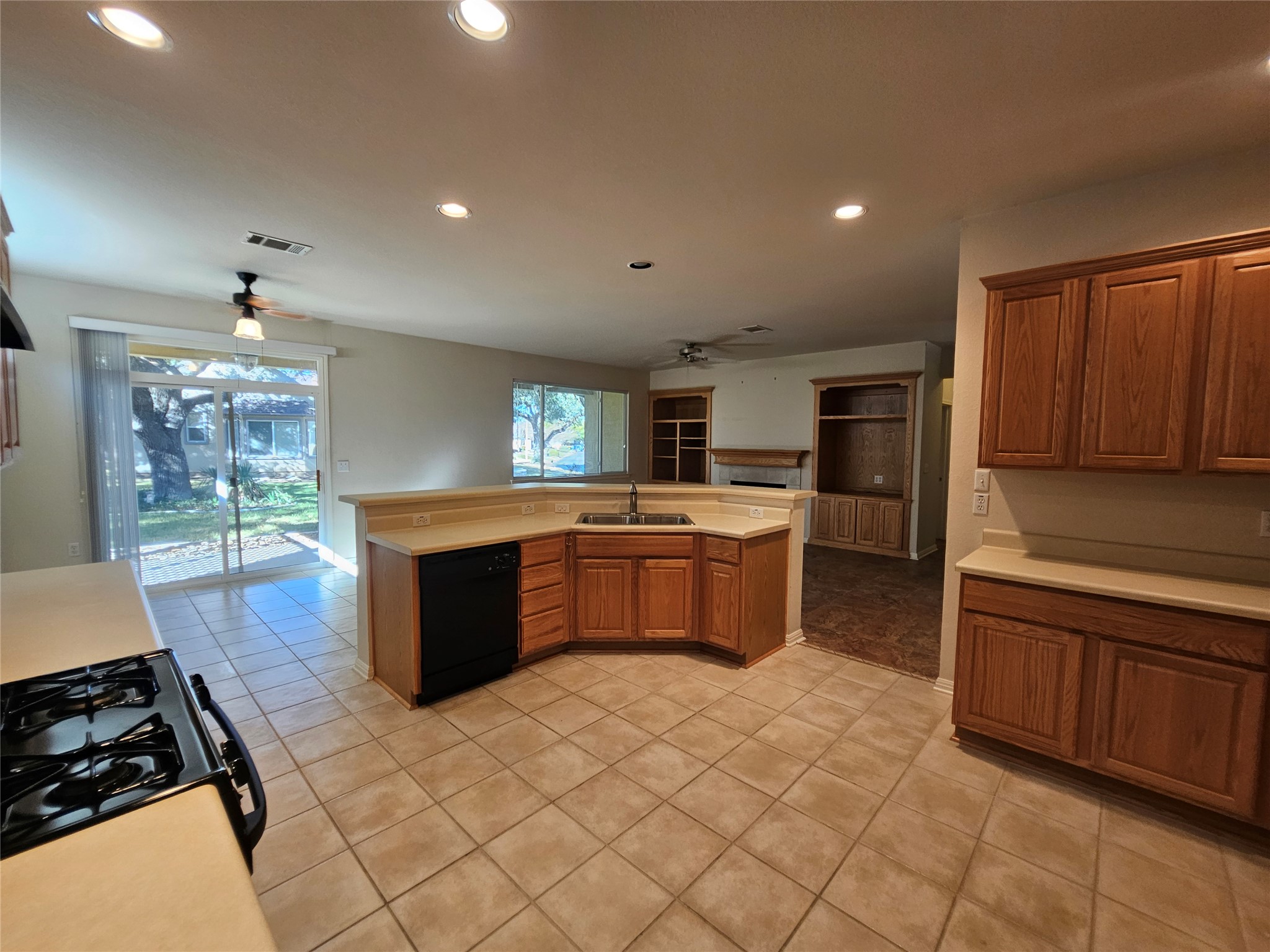 211 Red Poppy Trail Georgetown, TX 78633 - Photo 27 of 35 a kitchen with stainless steel appliances a sink and a stove top oven