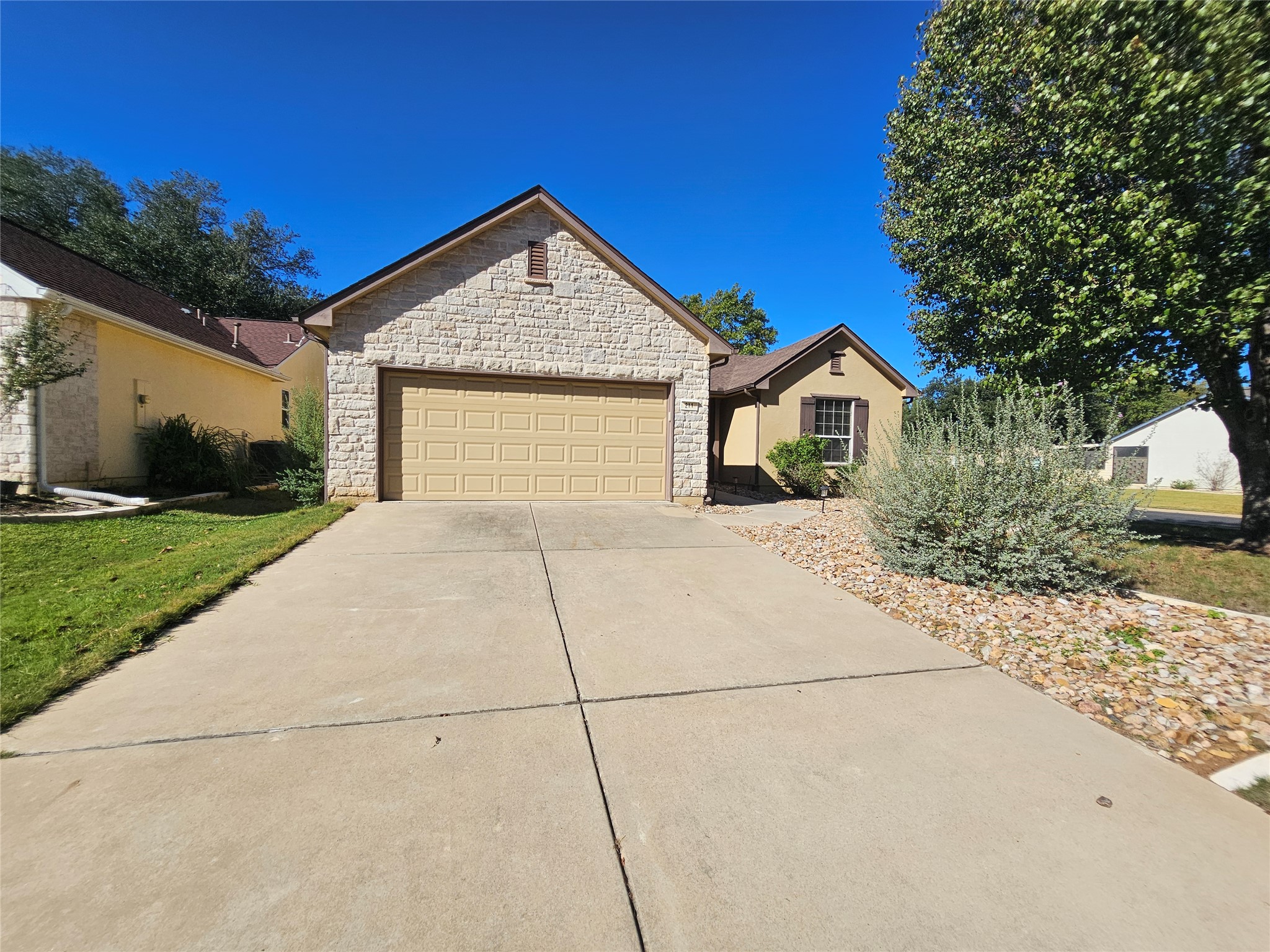 211 Red Poppy Trail Georgetown, TX 78633 - Photo 33 of 35 a front view of a house with a yard and garage