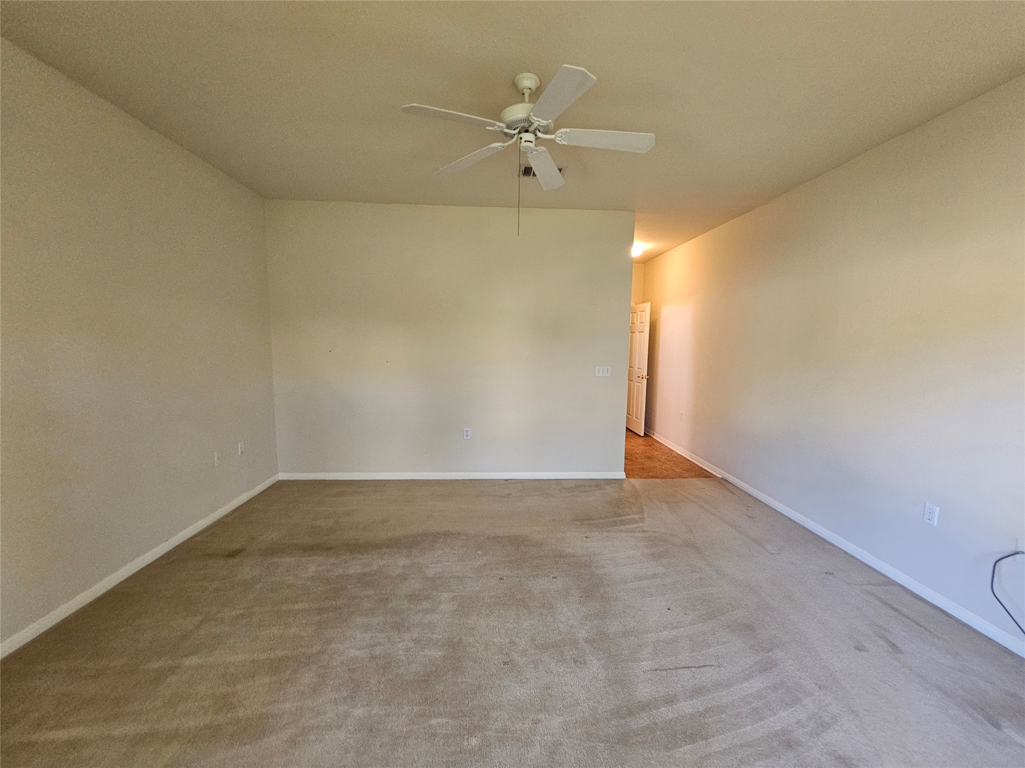 211 Red Poppy Trail Georgetown, TX 78633 - Photo 7 of 35 an empty room with a ceiling fan and a window