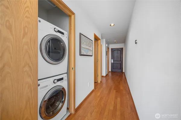 a view of a hallway with washer and dryer