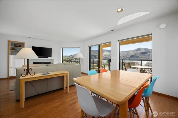a view of a dining room with furniture window and wooden floor