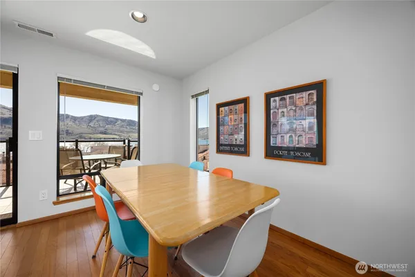 a view of a dining room with furniture window and wooden floor
