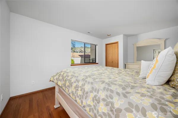 a bedroom with a bed and a dresser