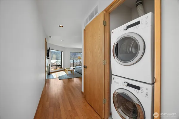 a view of a hallway with washer and dryer