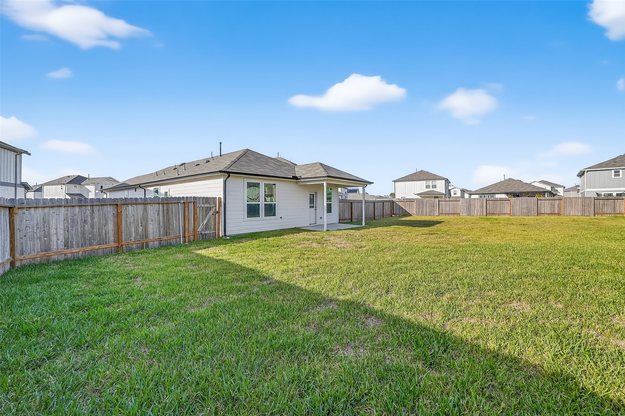 17902 Slurry Rake Lane Hockley, TX 77447 - Photo 26 of 32 a view of a house with yard and deck