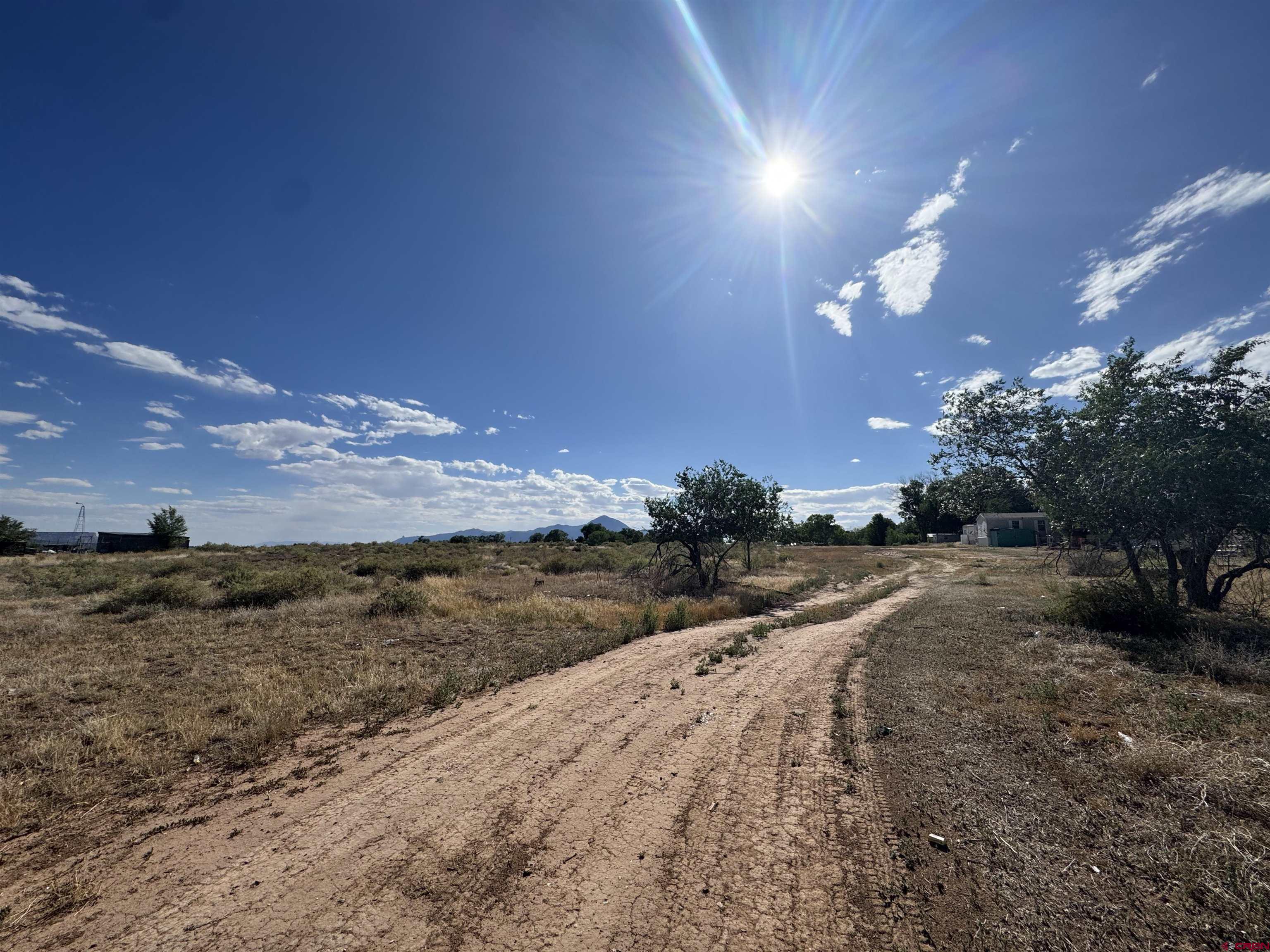 821 South Chestnut Street Cortez, CO 81321 - Photo 1 of 9 a view of a beach with a yard