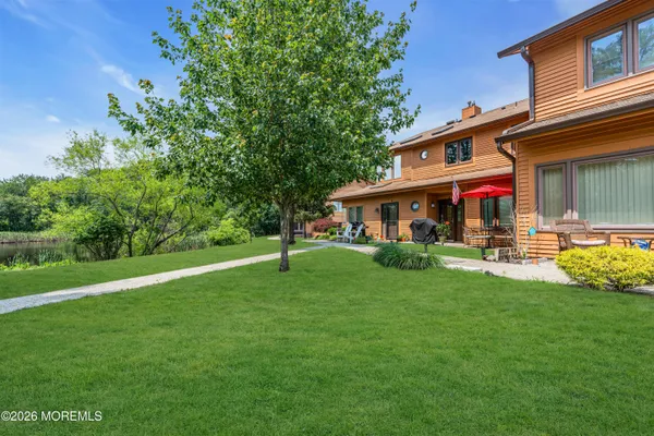 a view of a house with a backyard
