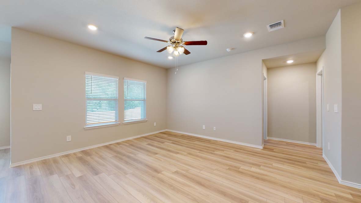 544 Hector Loop Georgetown, TX 78626 - Photo 10 of 22 Bright hardwood floors and abundant lighting define this versatile open-concept living space.