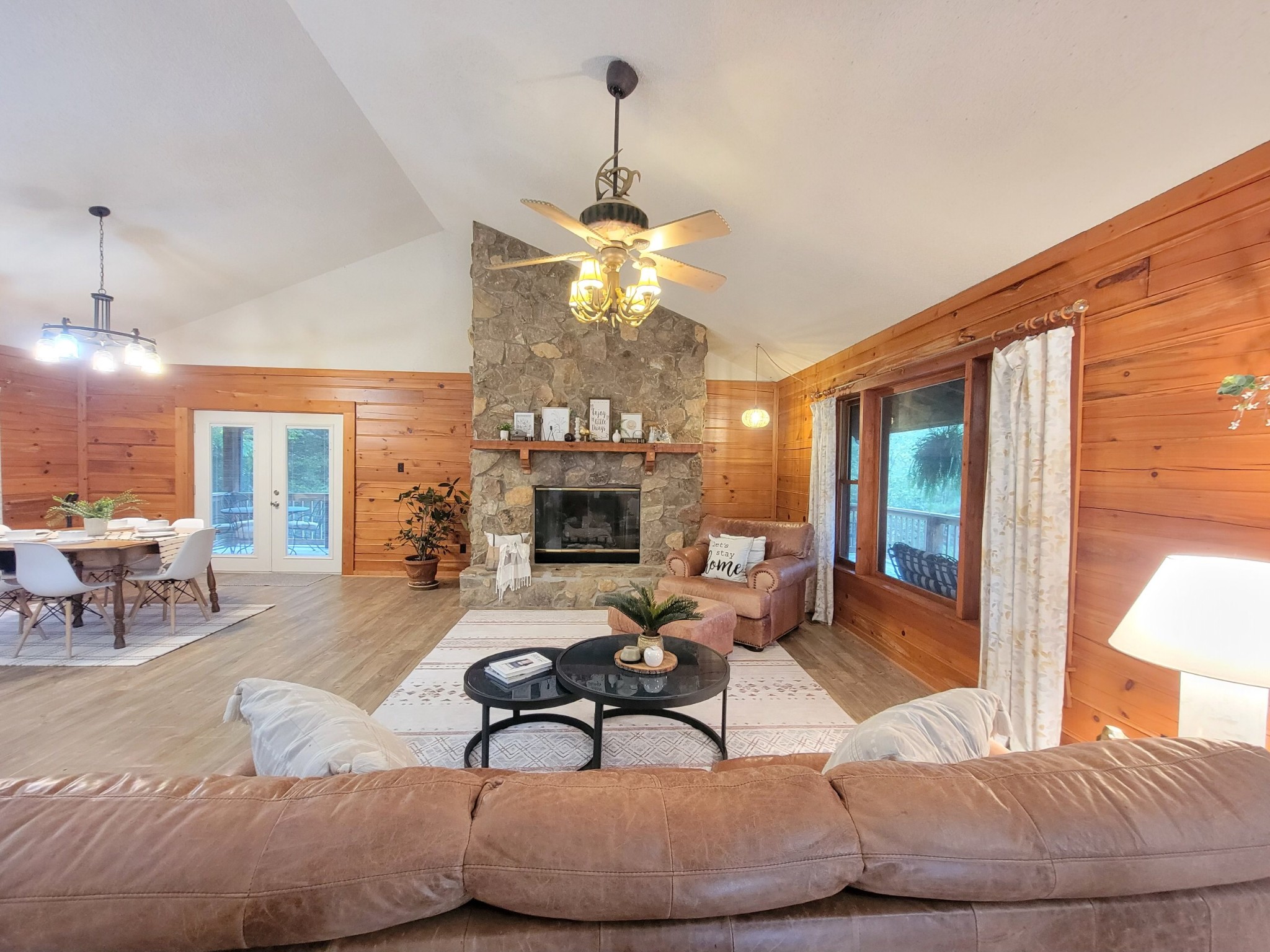 1006 Sullivan Drive White Bluff, TN 37187 - Photo 11 of 46 a living room with furniture a chandelier and a fireplace