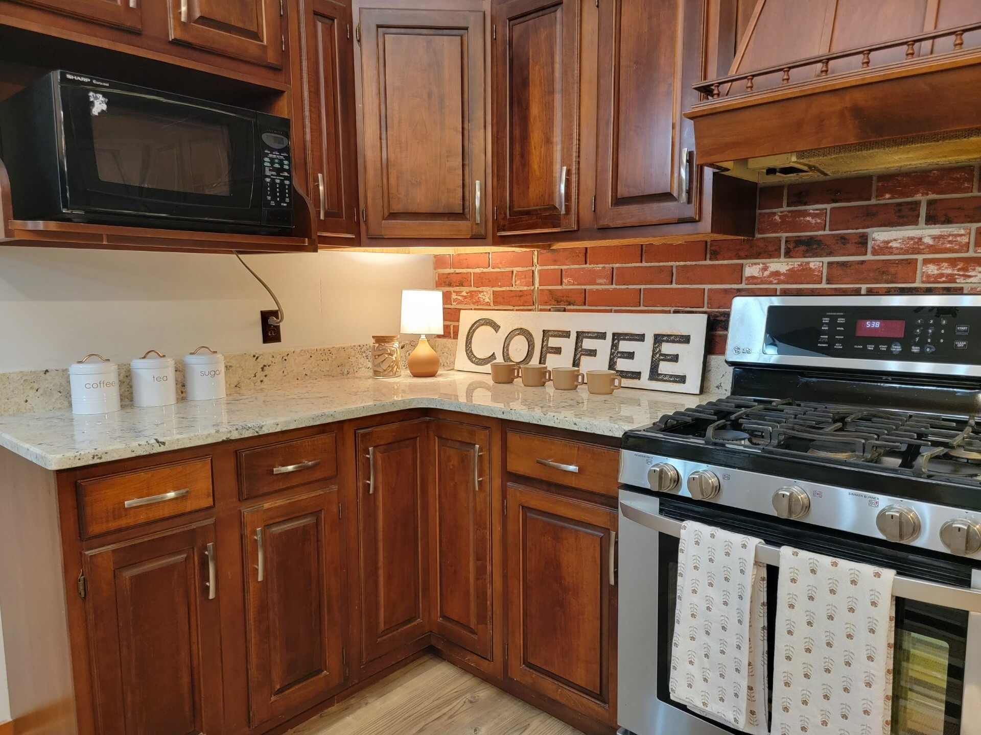 1006 Sullivan Drive White Bluff, TN 37187 - Photo 16 of 46 a kitchen with stainless steel appliances granite countertop a stove and a microwave
