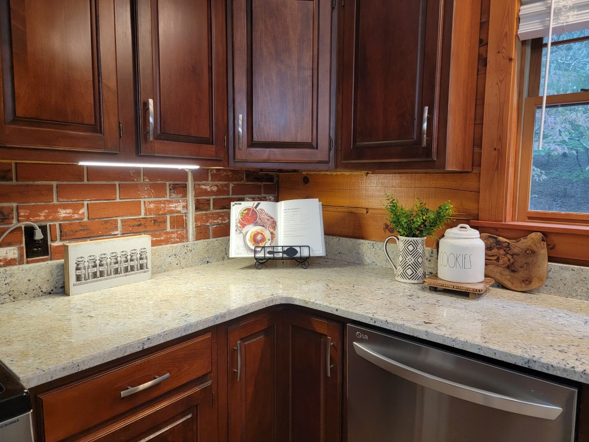 1006 Sullivan Drive White Bluff, TN 37187 - Photo 17 of 46 a kitchen with granite countertop wooden cabinets a sink and dishwasher