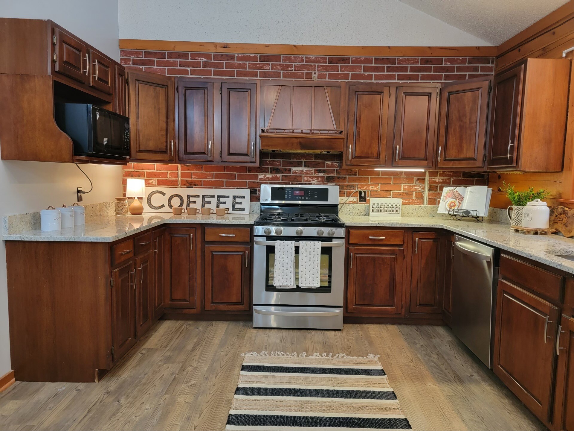 1006 Sullivan Drive White Bluff, TN 37187 - Photo 18 of 46 a kitchen with stainless steel appliances granite countertop a stove and a sink
