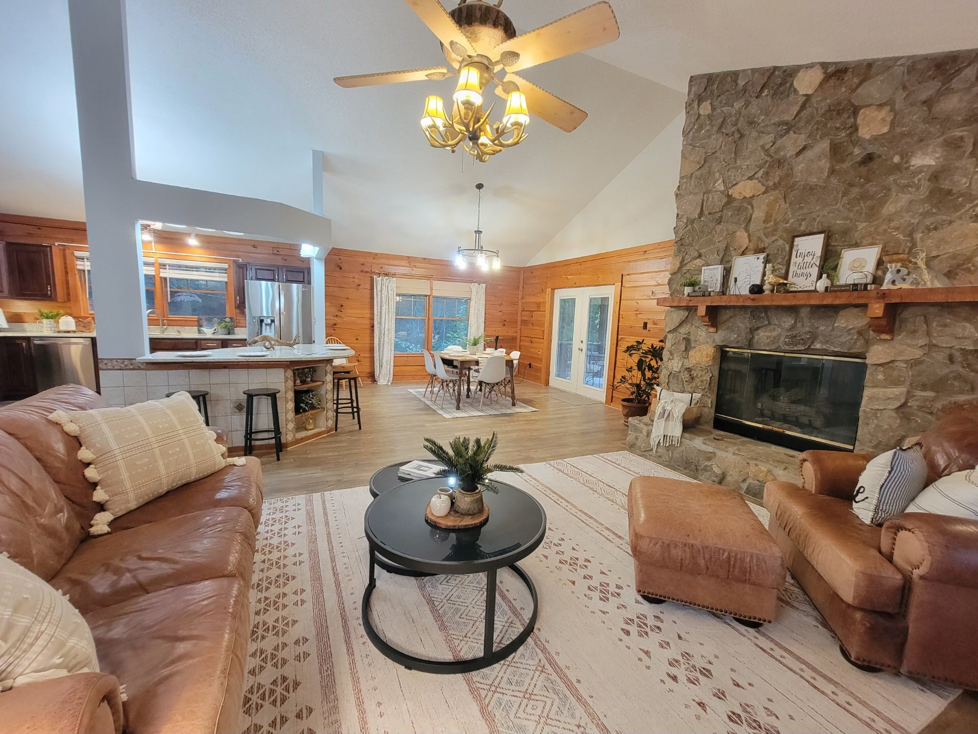 1006 Sullivan Drive White Bluff, TN 37187 - Photo 4 of 46 a living room with furniture a fireplace and a chandelier