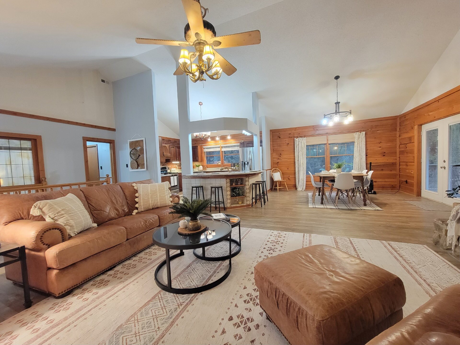 1006 Sullivan Drive White Bluff, TN 37187 - Photo 5 of 46 a living room with furniture a chandelier and a dining table