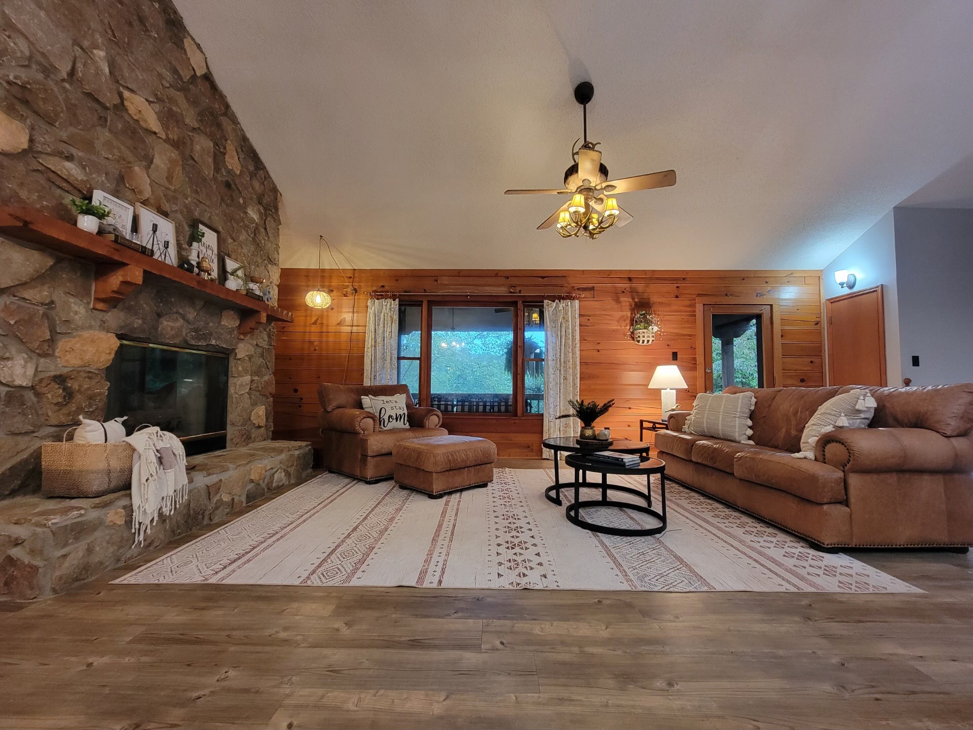 1006 Sullivan Drive White Bluff, TN 37187 - Photo 6 of 46 a living room with furniture a fireplace and a chandelier